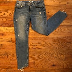 Mid-Waist light denim cropped ripped jeans